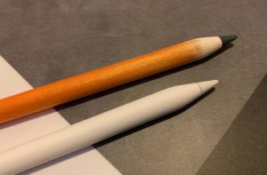 Sandpapering an Apple Pencil to make it look like a real wooden
